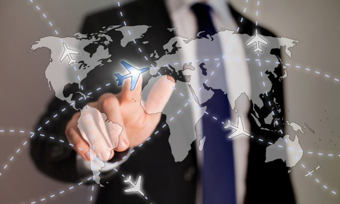 business travel concept, paths of airplanes on the worldmap